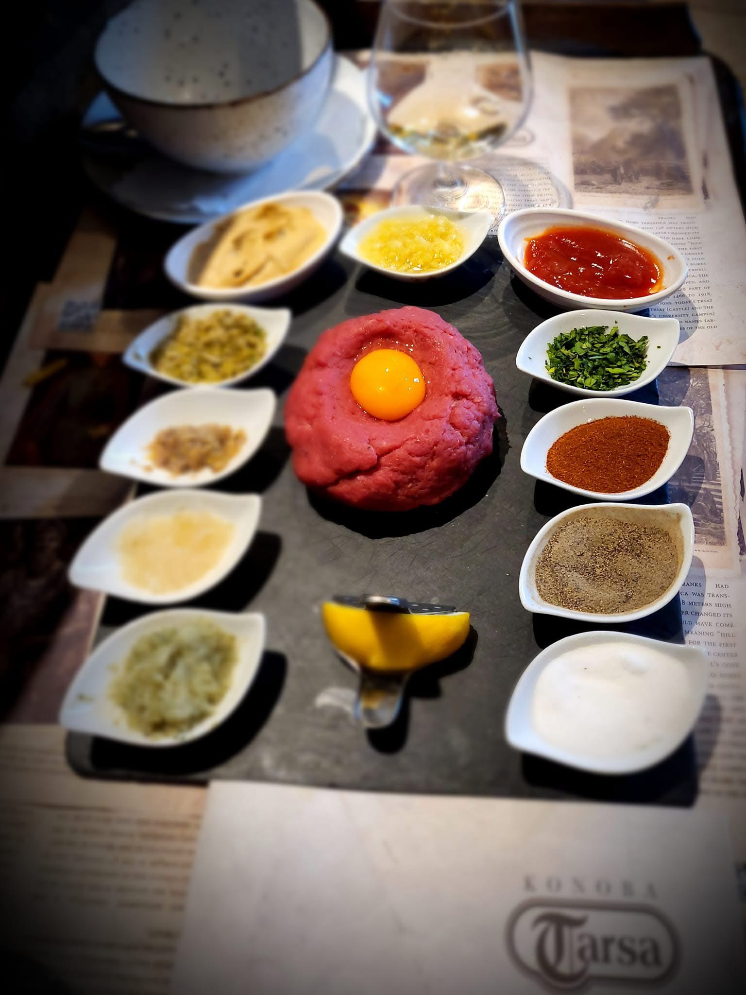 Steak tartare with egg yolk and condiments