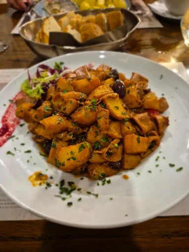 Hand-rolled fuži pasta in a rich sauce
